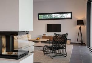 TV a/nebo společenská místnost v ubytování Hideaway Villa am Meer