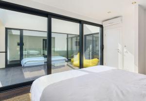 Postel nebo postele na pokoji v ubytování Hideaway Villa am Meer