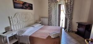 Postel nebo postele na pokoji v ubytování Patrizia Casa Vacanze