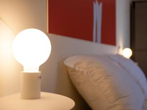 A bed or beds in a room at Lobby Collective Hostel - Lecce