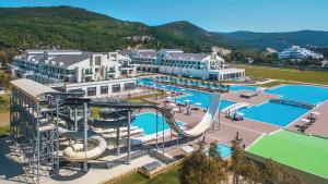 an aerial view of a resort with a water park at Korumar Ephesus Beach & Spa Resort - Ultra All Inclusive in Kusadası