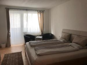 Łóżko lub łóżka w pokoju w obiekcie City Apartments Klinikum