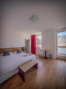 a bedroom with a bed and a desk at La Villa - Luxury Guest House in Trento