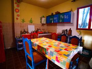 a table with a colorful table cloth on top of it at Namaste Hostel & Camping in Bar