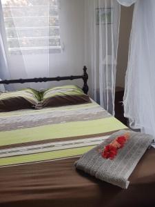 Postel nebo postele na pokoji v ubytování Kay Jean Au Diamant