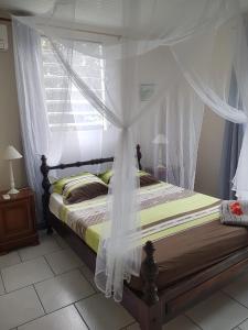 Postel nebo postele na pokoji v ubytování Kay Jean Au Diamant