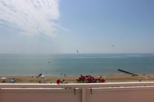 a view of the beach from a balcony at Hotel Loreley in Lido di Jesolo