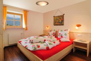 A bed or beds in a room at Steierhof