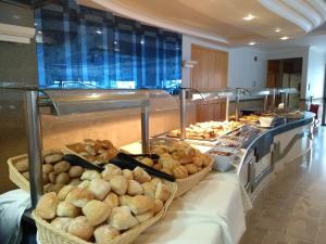 a buffet line with many different types of food at Paradise Bay Resort in Mellieħa
