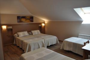 
a hotel room with a bed and two lamps at La Chopera in Collera
