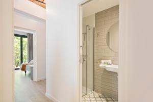 a bathroom with a shower and a sink at BcnStop Parc Güell in Barcelona +50 photos