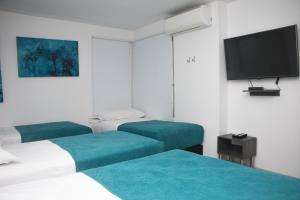 Uma cama ou camas num quarto em Hotel Onix T