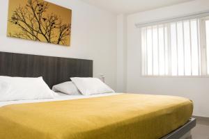 Uma cama ou camas num quarto em Hotel Onix T