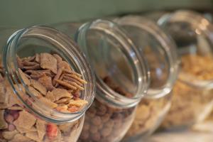 three glass jars filled with nuts and dry dog food at Nika otel & cafe in Istanbul