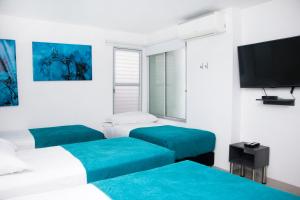 Uma cama ou camas num quarto em Hotel Onix T
