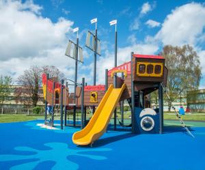 a playground with a slide in a park at Hotel Killarney in Killarney