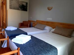 Postel nebo postele na pokoji v ubytování Hotel Alaska