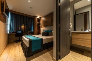 Postel nebo postele na pokoji v ubytování Hotel Blue Concept