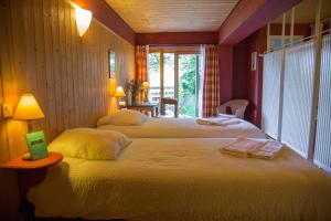 Cama o camas de una habitación en Plein Ciel - Hôtel d'altitude à 1800m