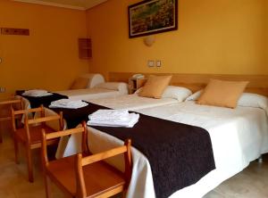 Postel nebo postele na pokoji v ubytování Hotel Alaska