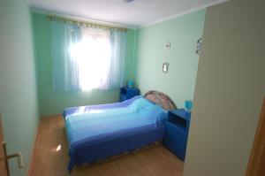 Postel nebo postele na pokoji v ubytování Apartments Juric by El-Pi Tours
