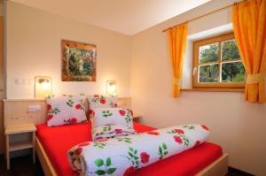 A bed or beds in a room at Steierhof