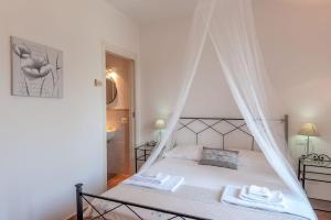 Postel nebo postele na pokoji v ubytování Le Tartarughe rooms