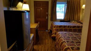 Postel nebo postele na pokoji v ubytování Royal Motor Inn