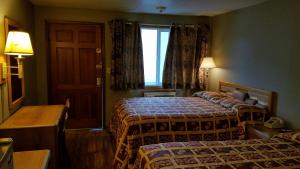 Postel nebo postele na pokoji v ubytování Royal Motor Inn