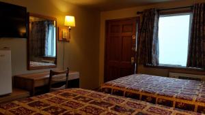 Postel nebo postele na pokoji v ubytování Royal Motor Inn