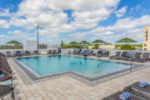 a swimming pool on the roof of a hotel at Wyndham Garden Ft Lauderdale Airport & Cruise Port in Dania Beach