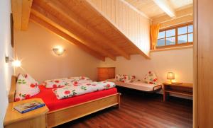 A bed or beds in a room at Steierhof
