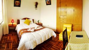 Postel nebo postele na pokoji v ubytování Hostal Comarca Imperial