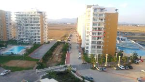 an aerial view of a city street with buildings at Angel's Apartment at Caesar Resort in Trikomo