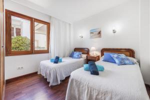 En eller flere senge i et værelse på Apartment Lauba