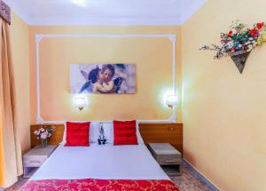 A bed or beds in a room at Downtown Accommodation
