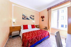 A bed or beds in a room at Downtown Accommodation