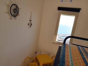 a bedroom with a bed and a window at Sciacca sea view holidays centro storico in Sciacca