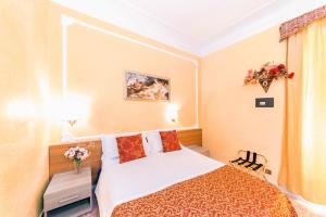 A bed or beds in a room at Downtown Accommodation