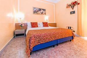 A bed or beds in a room at Downtown Accommodation