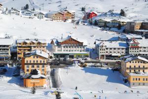 a small town covered in snow with buildings at Appartements Insieme in Obertauern