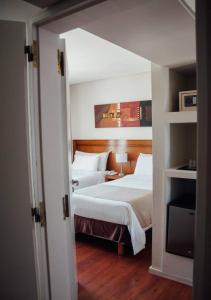 Voodi või voodid majutusasutuse Herradura Hotel Suites toas