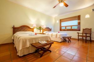 Letto o letti in una camera di The Lodge At Uxmal