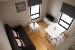 an overhead view of a living room with a couch and a table at ESTUDIO REAL 8 in Cangas de Morrazo
