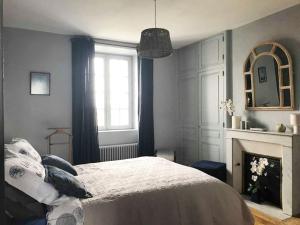 En eller flere senger på et rom på Le Compostelle Chic, Charme, Confort, Cocooning 80 m²