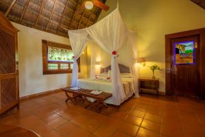 Letto o letti in una camera di The Lodge At Uxmal
