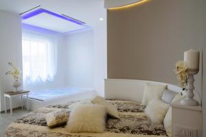 Cama ou camas em um quarto em Bellariva Monopoli B&B e Relax