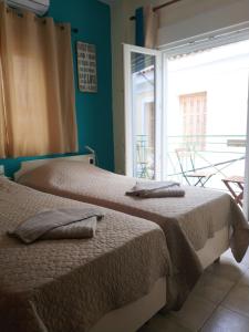 Postel nebo postele na pokoji v ubytování Sokaki rooms
