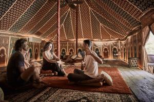 a group of men sitting in a room at Nomade Tulum in Tulum