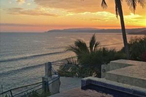 a view of the ocean at sunset from a resort at Ocean View Echemare Tango Mar in Tambor